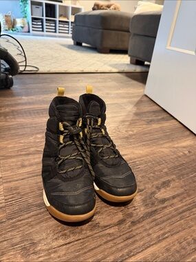 Sorel Black and Gum Lace-Up Winter Boots with Yellow Accents